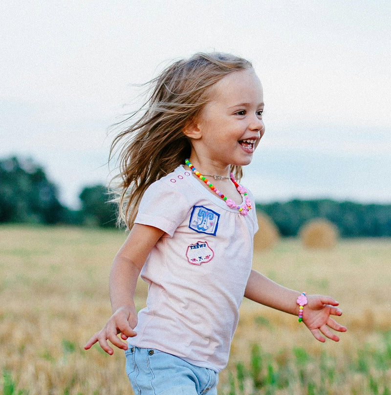 Happy child running in a field